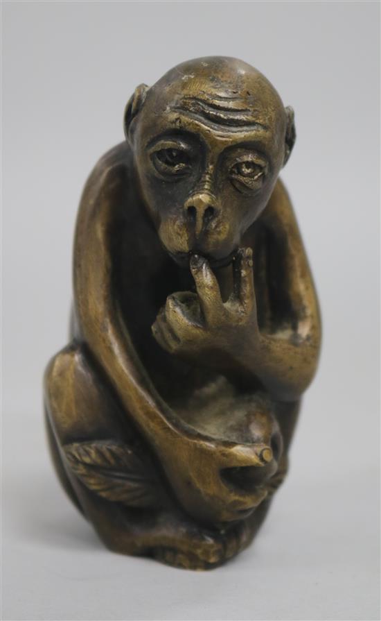A bronze monkey vesta